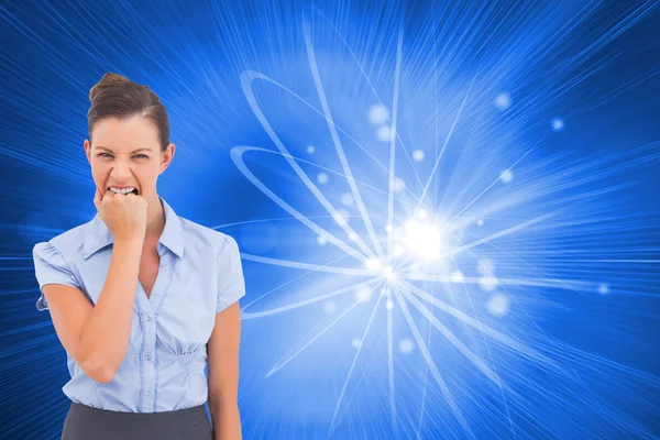 Composite image of furious businesswoman looking at the camera — Stock Photo, Image