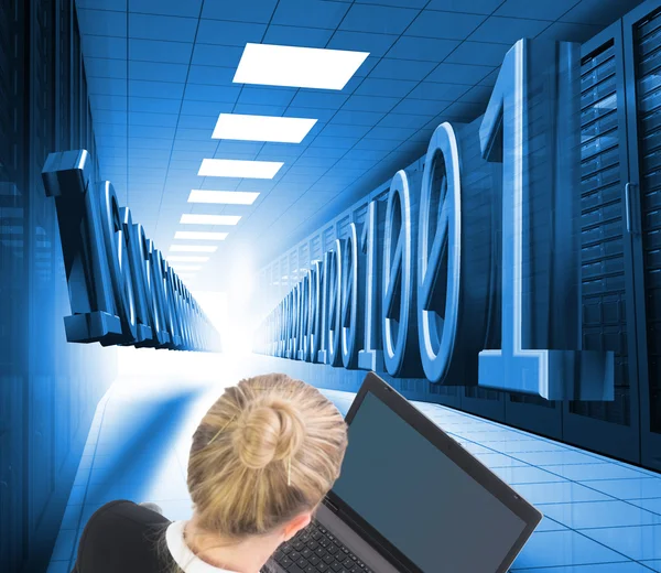 Composite image of businesswoman using laptop — Stock Photo, Image