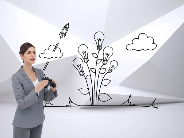 Curious young businesswoman with binoculars — Stock Photo, Image