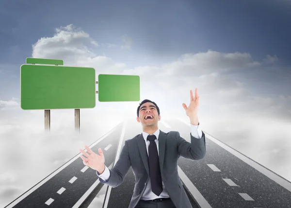 Composite image of excited businessman catching — Stock Photo, Image