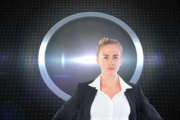 Composite image of businesswoman standing with hands on hips — Stock Photo, Image