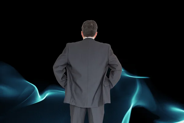 Composite image of businessman standing back to the camera — Stock Photo, Image