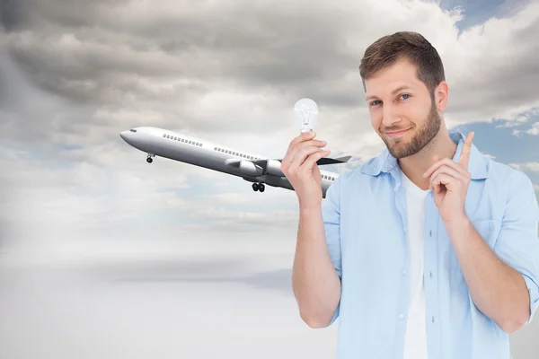 Model holding a bulb in right hand — Stock Photo, Image