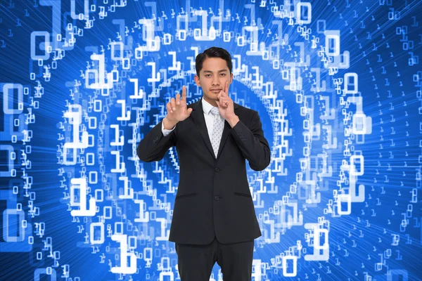 Composite image of thoughtful asian businessman pointing — Stock Photo, Image