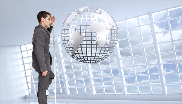 Stern businessman standing on ladder — Stock Photo, Image