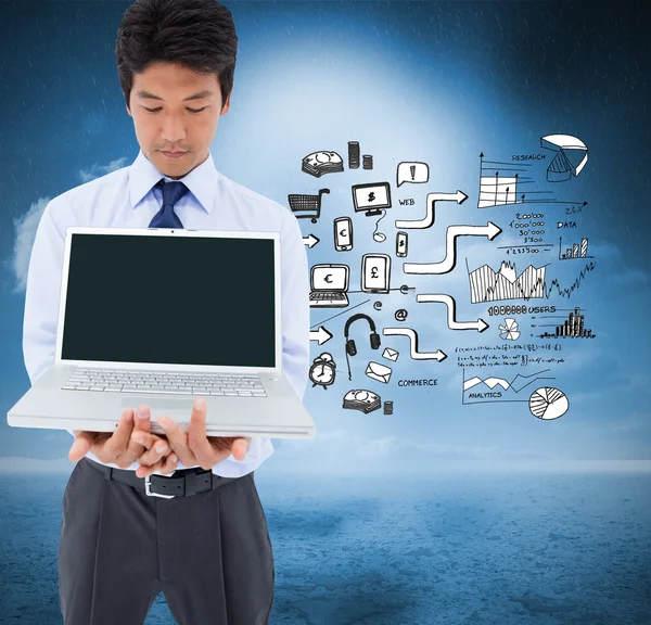 Businessman showing a laptop — Stock Photo, Image