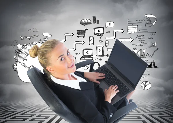 Composite image of businesswoman sitting on swivel chair with laptop — Stock Photo, Image