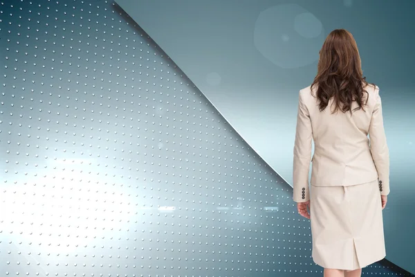 Composite image of classy businesswoman walking away from camera — Stock Photo, Image