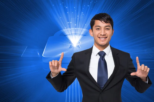 Composite image of smiling businessman holding — Stock Photo, Image
