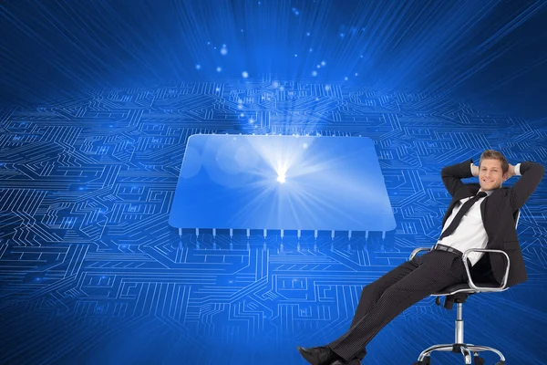 Young businesssman in office sitting on chair — Stock Photo, Image