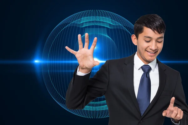 Composite image of smiling businessman holding and pointing — Stock Photo, Image