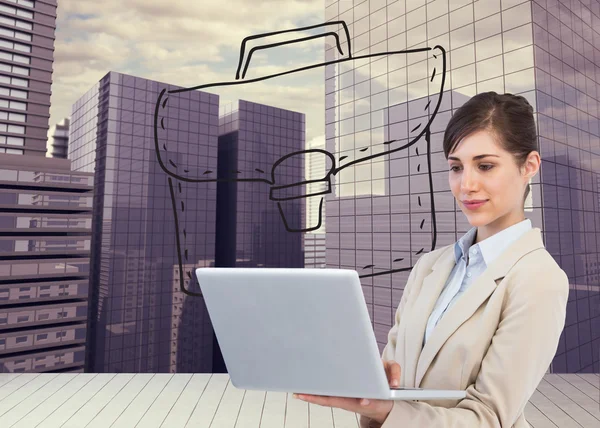 Confident businesswoman holding laptop — Stock Photo, Image