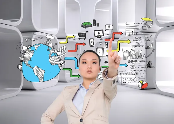 Unsmiling asian businesswoman pointing — Stock Photo, Image