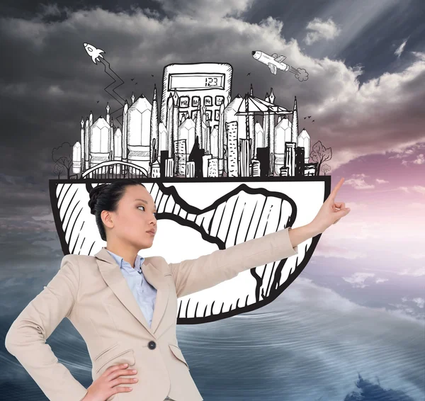 Composite image of unsmiling asian businesswoman pointing — Stock Photo, Image