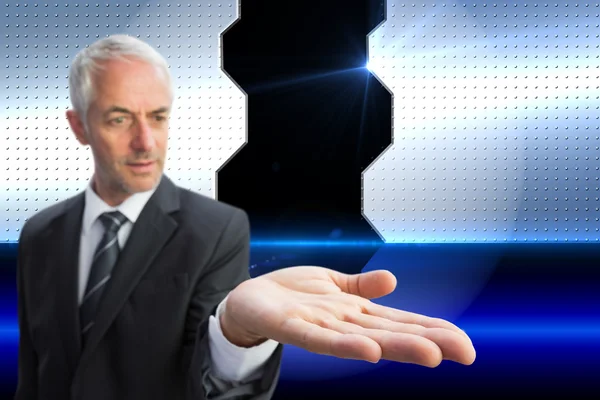 Samengestelde afbeelding van geconcentreerde zakenman met palm omhoog — Stockfoto