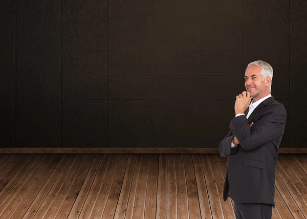 Imagen compuesta de hombre de negocios feliz mirando hacia otro lado — Foto de Stock