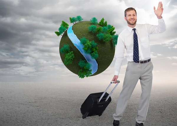 Composite image of handsome businessman with suitcase waving — Stock Photo, Image