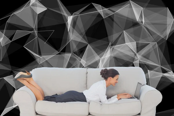Business woman lying on couch — Stock Photo, Image
