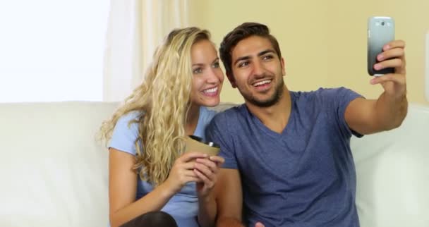 Man taking a photo of himself and his pretty girlfriend — Stock Video