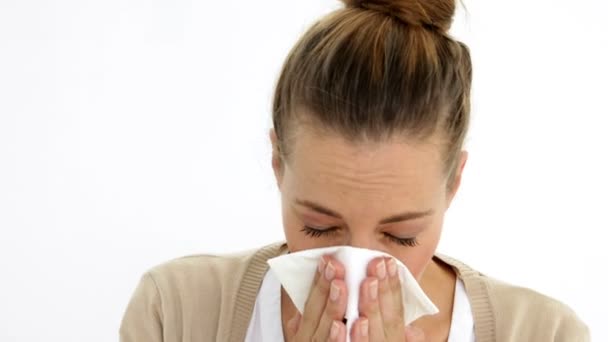 Sick ponytailed woman sneezing — Stock Video
