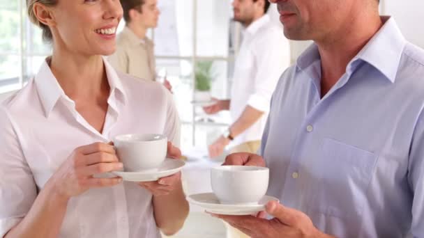 Attractive colleagues chatting while having a break — Stock Video