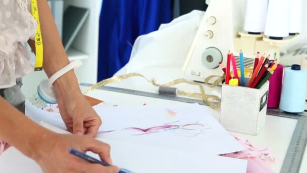 Fashion designer sketching a dress design — Stock Video