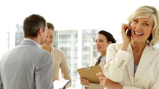 Happy businesswoman talking on phone — Stock Video