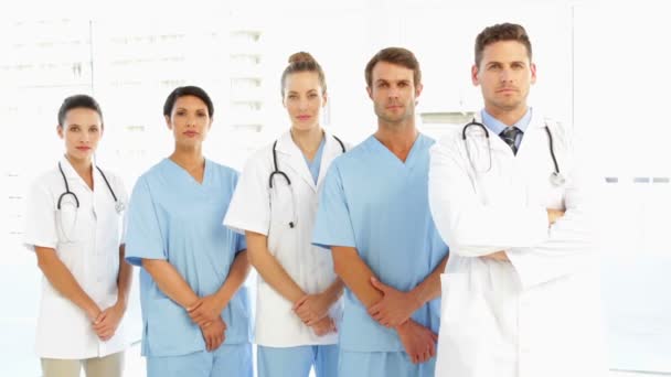 Frowning medical team with hands together — Wideo stockowe