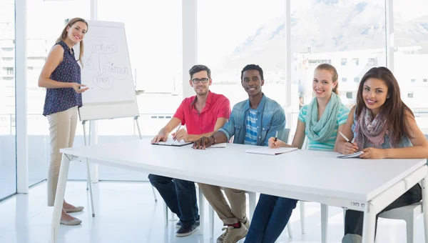 Casual business people in office at presentation — Stock Photo, Image