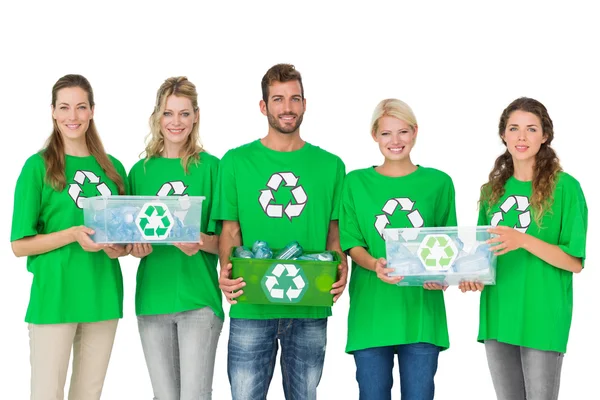 People in recycling symbol t-shirts carrying boxes — Stock Photo, Image