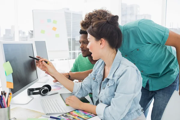 Three artists working on computer at office — Stock Photo, Image