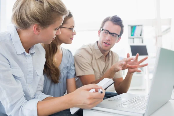 Three young people working on computer — Stock Photo, Image