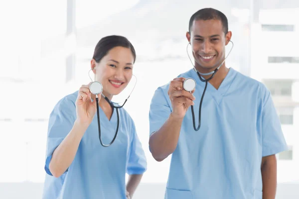 Doctors with stethoscopes in hospital — Stock Photo, Image