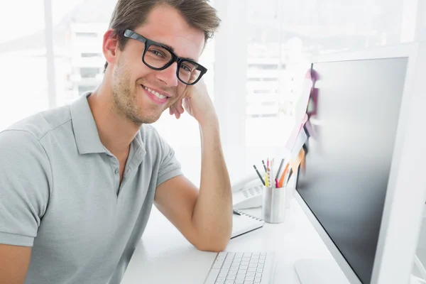 Side view of male photo editor working on computer — Stock Photo, Image