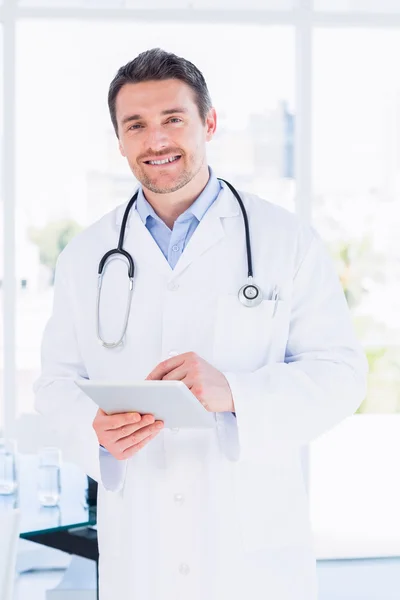 Portrait of a male doctor using digital tablet — Stock Photo, Image