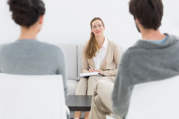 Female financial adviser in meeting with young couple — Stock Photo, Image