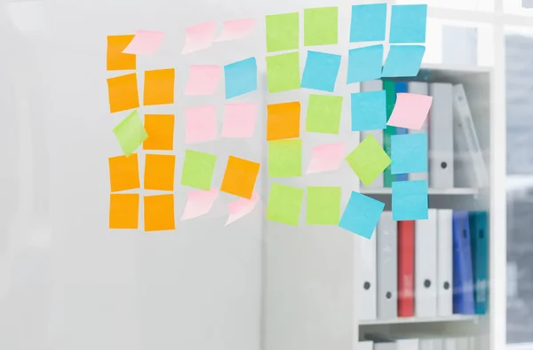 Close-up of colorful sticky notes at office — Stock Photo, Image
