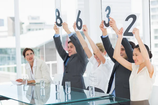 Judges in a row holding score signs — Stock Photo, Image