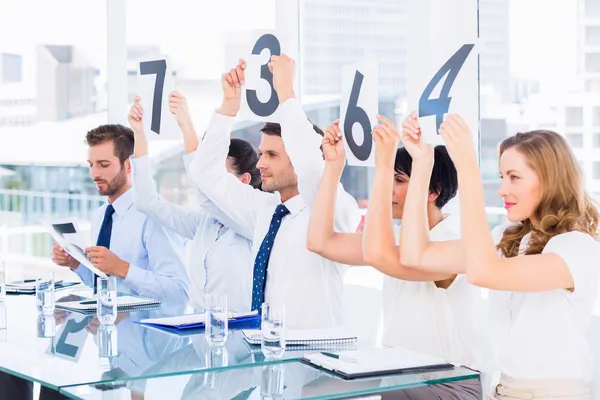 Group of panel judges holding score signs — Stock Photo, Image