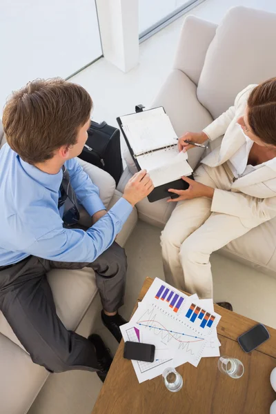 Business team working on the couch scheduling in diary — Stock Photo, Image