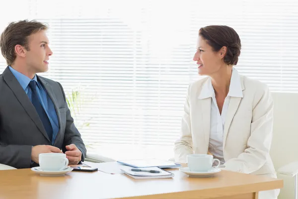 Smartly dressed couple in a business meeting — Stock Photo, Image