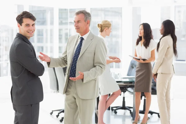 Business people talking together in conference room — Stock Photo, Image