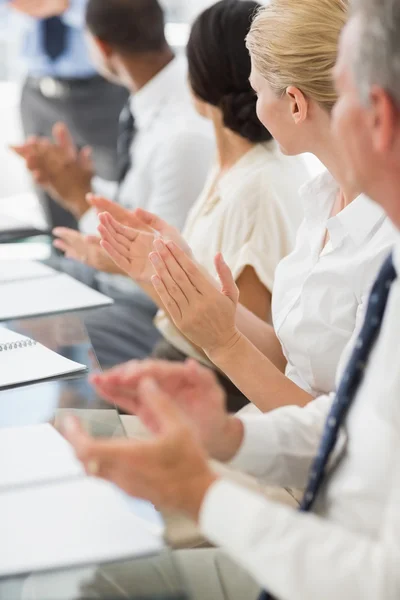 Business people clapping colleague at a meeting — Stock Photo, Image