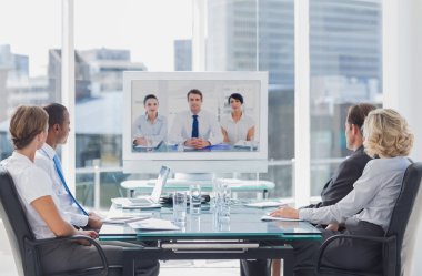 Business team having video conference clipart