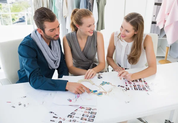 Three fashion designers discussing designs — Stock Photo, Image