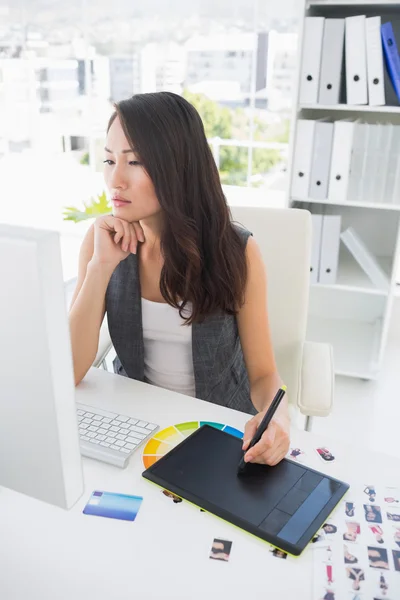 Side view of casual photo editors working on computer — Stock Photo, Image