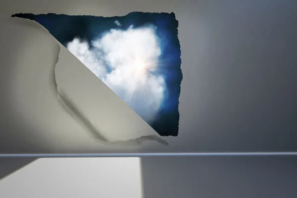 Rip on wall showing cloud graphic — Stock Photo, Image