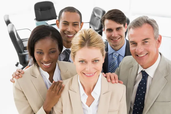 Diverse close business team smiling up at camera — Stock Photo, Image