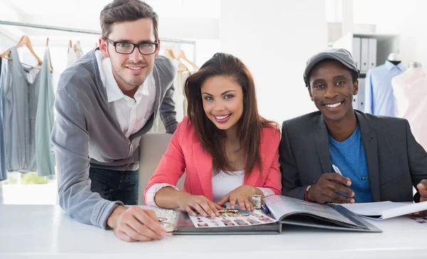 Fashion designers discussing designs — Stock Photo, Image