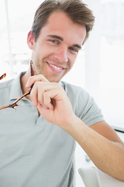 Portrait of a casual male photo editor smiling — Stock Photo, Image